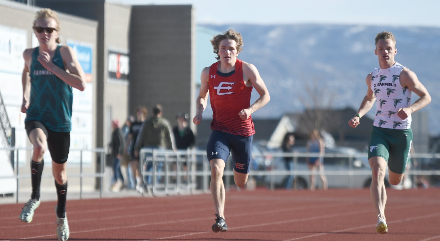EHS sprinter Gabe Hutchinson (middle) turns into the back stretch of the 400 meter dash Thursday at the Farmington Super Meet in Utah. Hutchinson finished third in the event, with a time of 49.65; he also finished third in the 100 meters, with a time of 10.97.