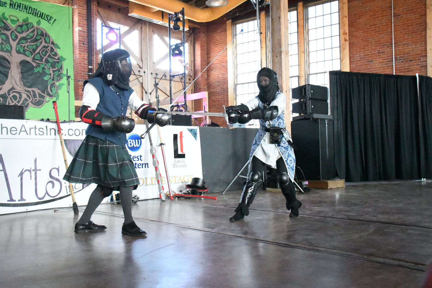 Nathaniel Douglas and Val Lynch demonstrate their sword-fighting skills during this year’s Celtic Festival at the Roundhouse in Evanston on March 23.