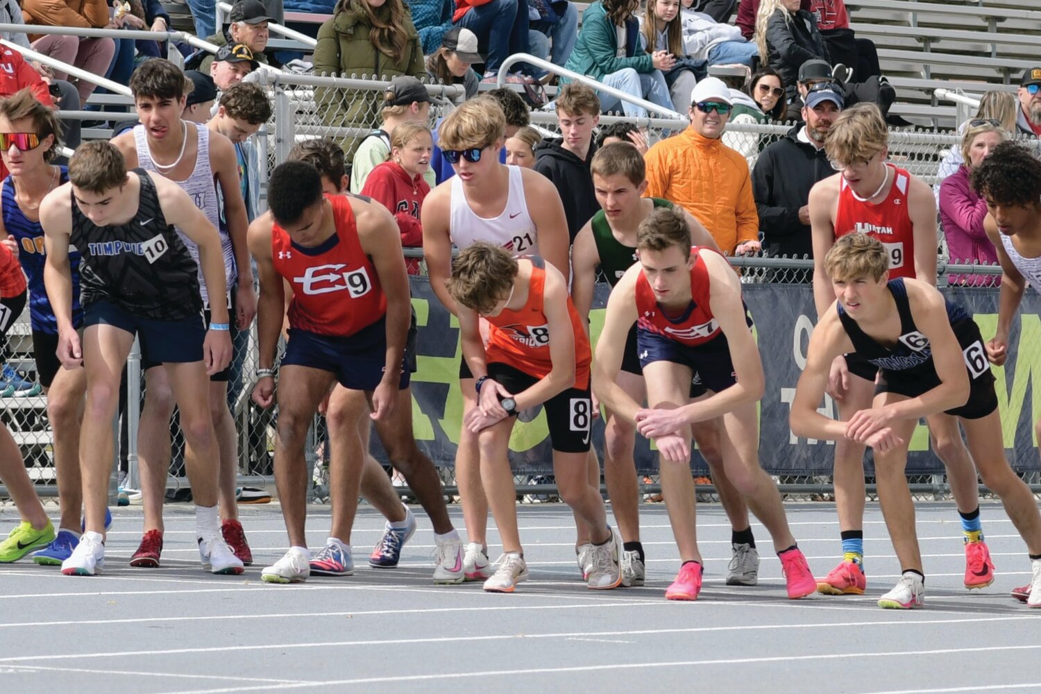 EHS distance runneers Jamar McDowell (No.9, left) and Paul Baxter (No. 7) ready themselves at the starting line of the 1600 meters last week at the Alpha Invitational, in Orem, Utah. McDowell finished 25th, while Baxter finished 30th.