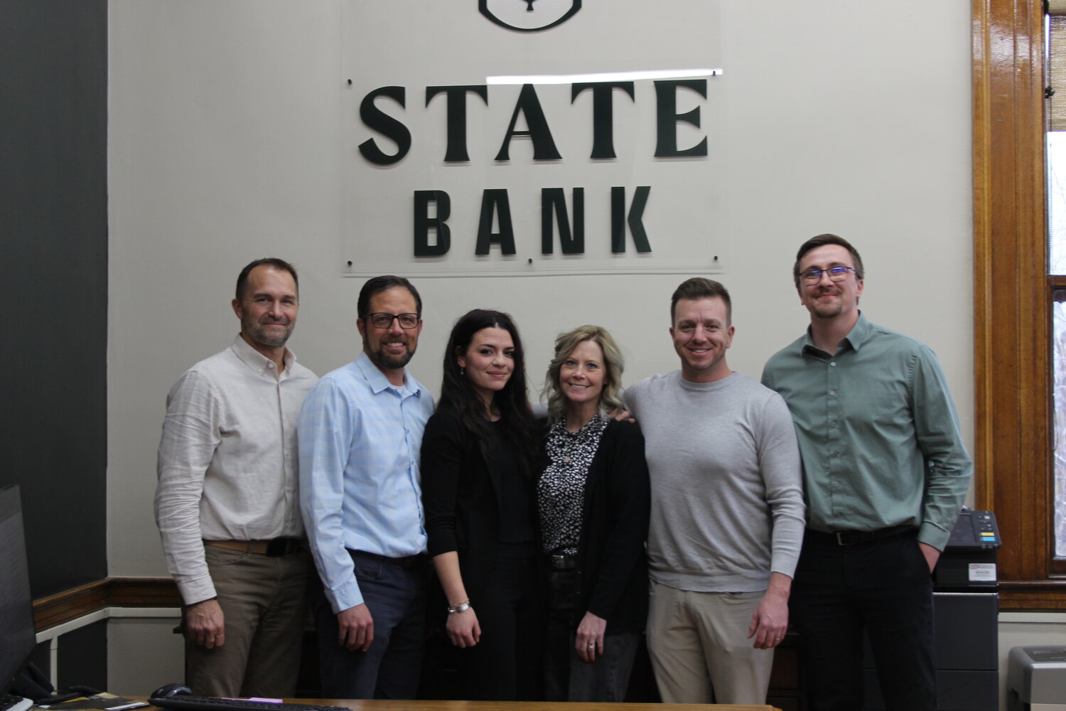 State Bank President Jon Dolezal, CEO Cody Bateman, personal banker and loan processor Madison Maust, personal banker Ronnie Sommerville, Vice President of Business Development David O’Connell Jr., and loan officer Taylor Siemers are pictured earlier this month. Evanston’s newest bank held a grand opening on Friday, April 12. It is located inside the old Post Office.