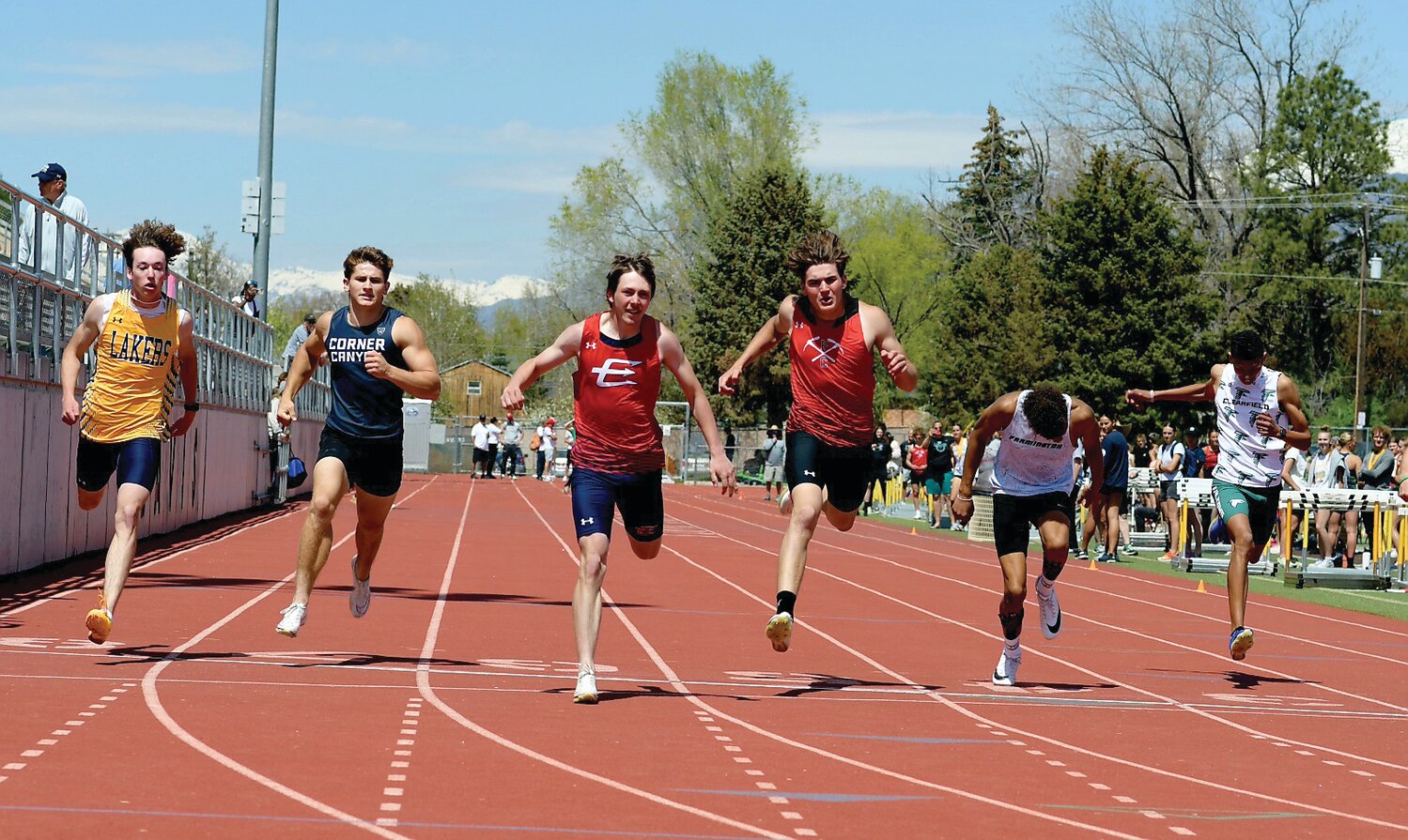 Red Devil sprinter Ayden Hartzell (3rd from left) wins the open 200 meter dash at Saturday’s Davis Invitational, held at Davis High School in Kaysville, Utah. Hartzell’s time of 21.99 set a new school record in the event; the speedy junior also set a new record in the 400 meter run, with a time of 48.89. Both records were previously held by Hartzell’s teammate, senior Gabe Hutchinson.