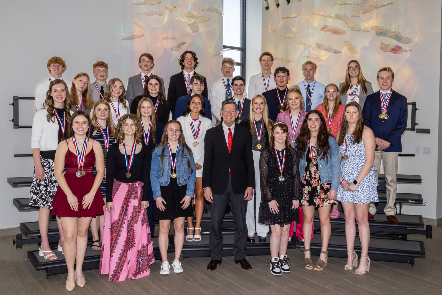 Sen. John Barrasso, center, and 28 of the 34 Wyoming Congressional Award recipients pose with their medals following a special ceremony on Sunday, April 21. Among the honorees are Pinedale High School senior Seren Noble, a silver medalist, (second row back and second to the right) and Big Piney High School sophomore Cambry Jenks (not pictured), a gold medalist.