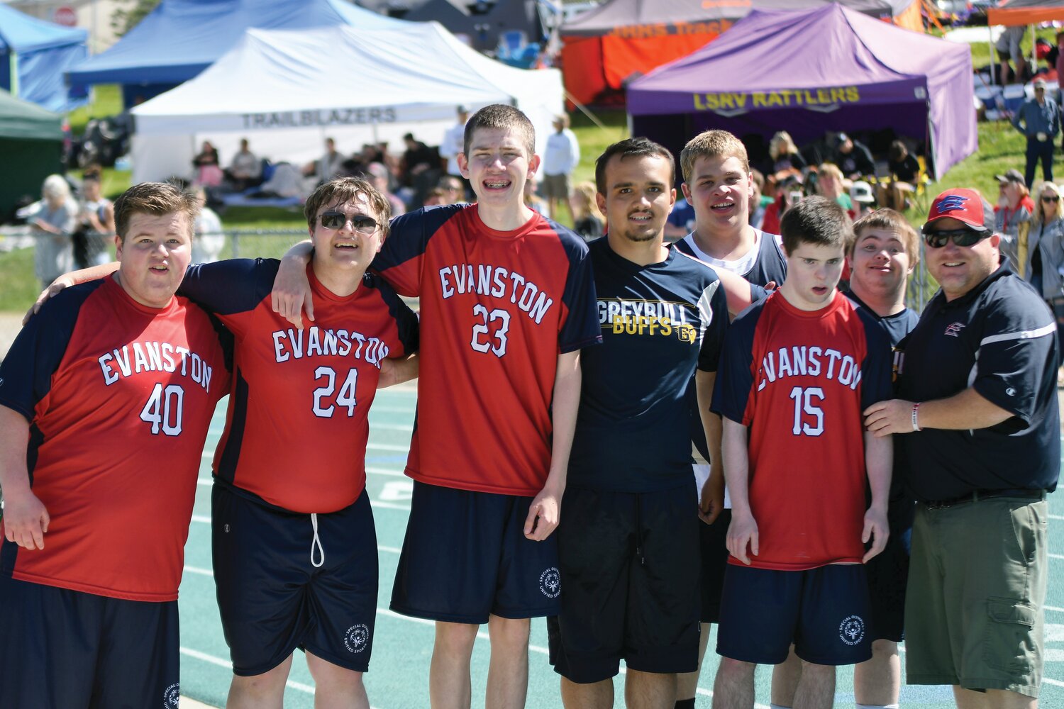 Members of the EHS unified track and field team that competed in the 100 meter dash included, from left: Homer Bodily, Shane Ruth, Hunter Brown, Landen Tethal and coach Dave Deru.