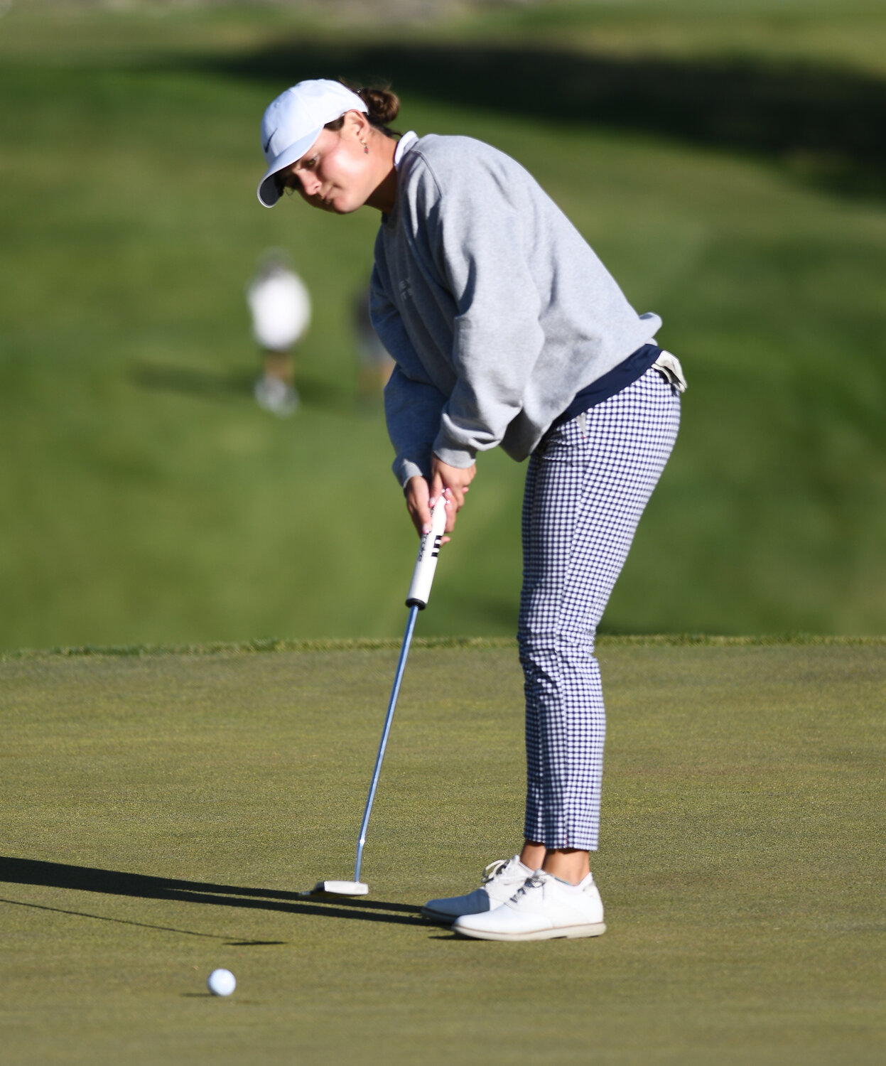 Evanston's Kyra Sponenburgh rolls in a putt during the second round of the WSGA Amateur Championship at the Purple Sage Golf Course. Sponenburgh and Tazlyn Wagner were grouped together Saturday.