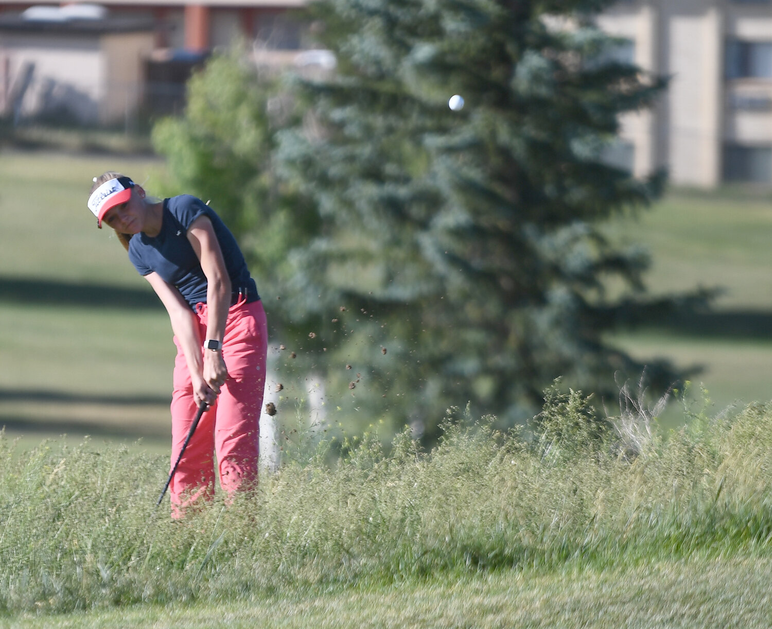 Kemmerer golfer Tazlyn Wagner blasts her ball out of the rough leading up to hole #3 Saturday at Purple Sage Golf Course. Wagner finished eighth at the WSGA Amateur Championship.