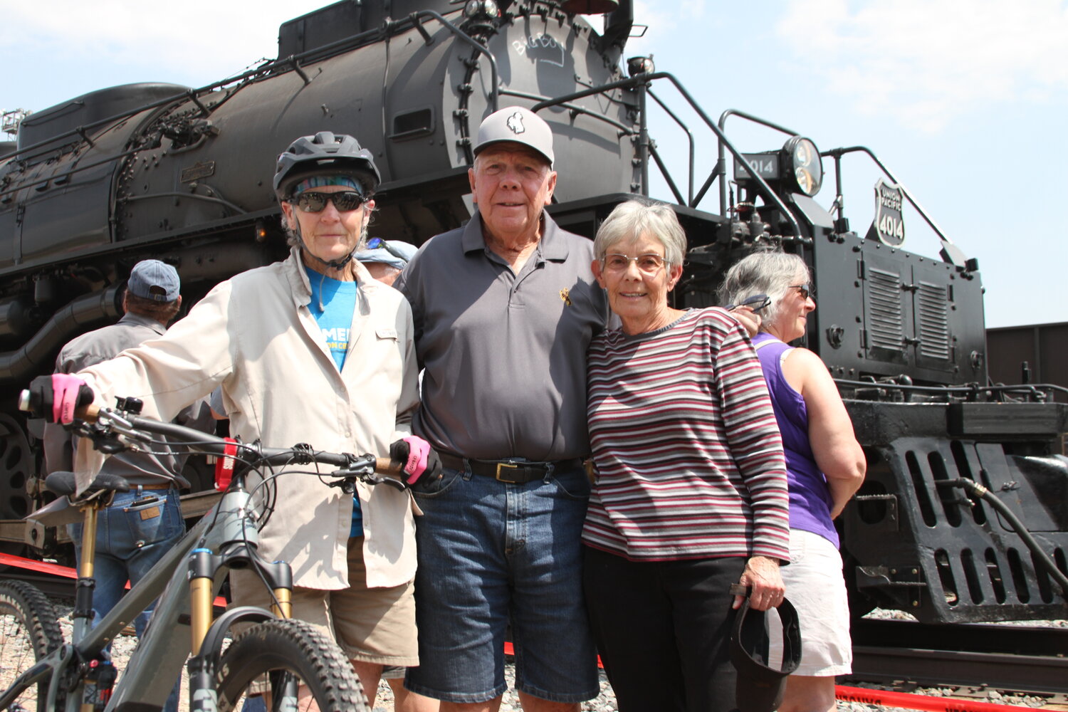 Liz Parker, Joe Fagnant and Diane Fagnant pose in front of the Big Boy steam engine that was in town last week.