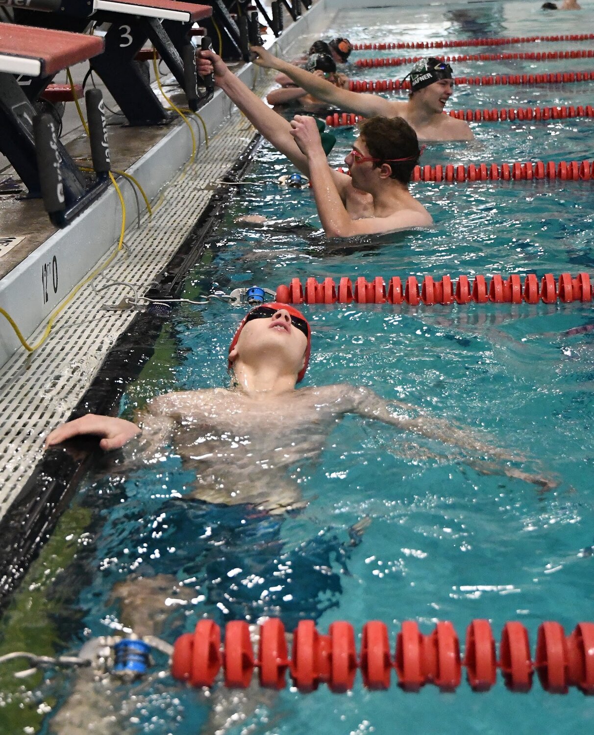 Red Devil swimmer Brady Schmidt reacts to just missing a state-qualifying time in the 50 freestyle by .09 of a second.