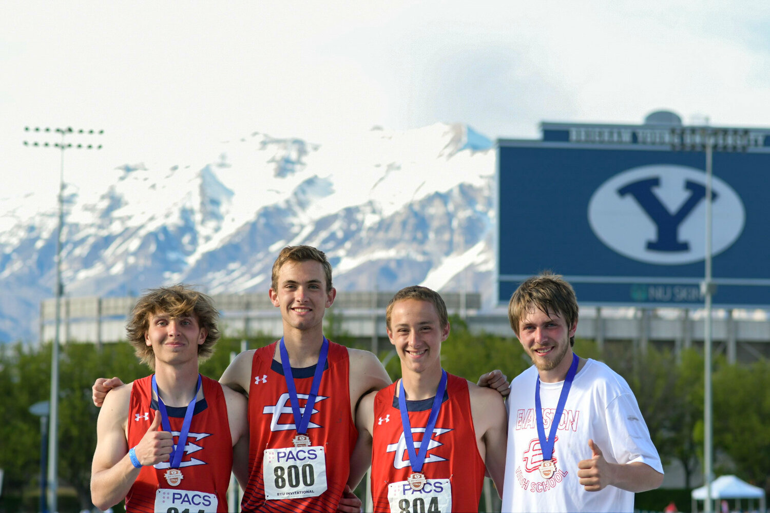 The 4x400 team of Jayden Rieker, Paul Baxter, Aidan Conrad and Ayden Hartzell is all smiles after setting a new school record in the event at the BYU Invite with a time of 3:21.26; the team also medaled, placing sixth overall.