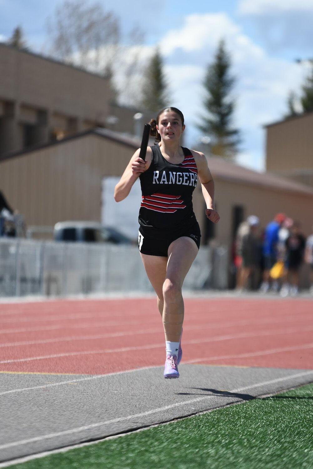 Lady Ranger Janae Skidmore runs her leg of the sprint medley relay at last week’s Schuler Invite in Evanston. Along with teammates Hadlee Wood, Natasha Martinez and Ella Thatcher, the team finished third in the event.