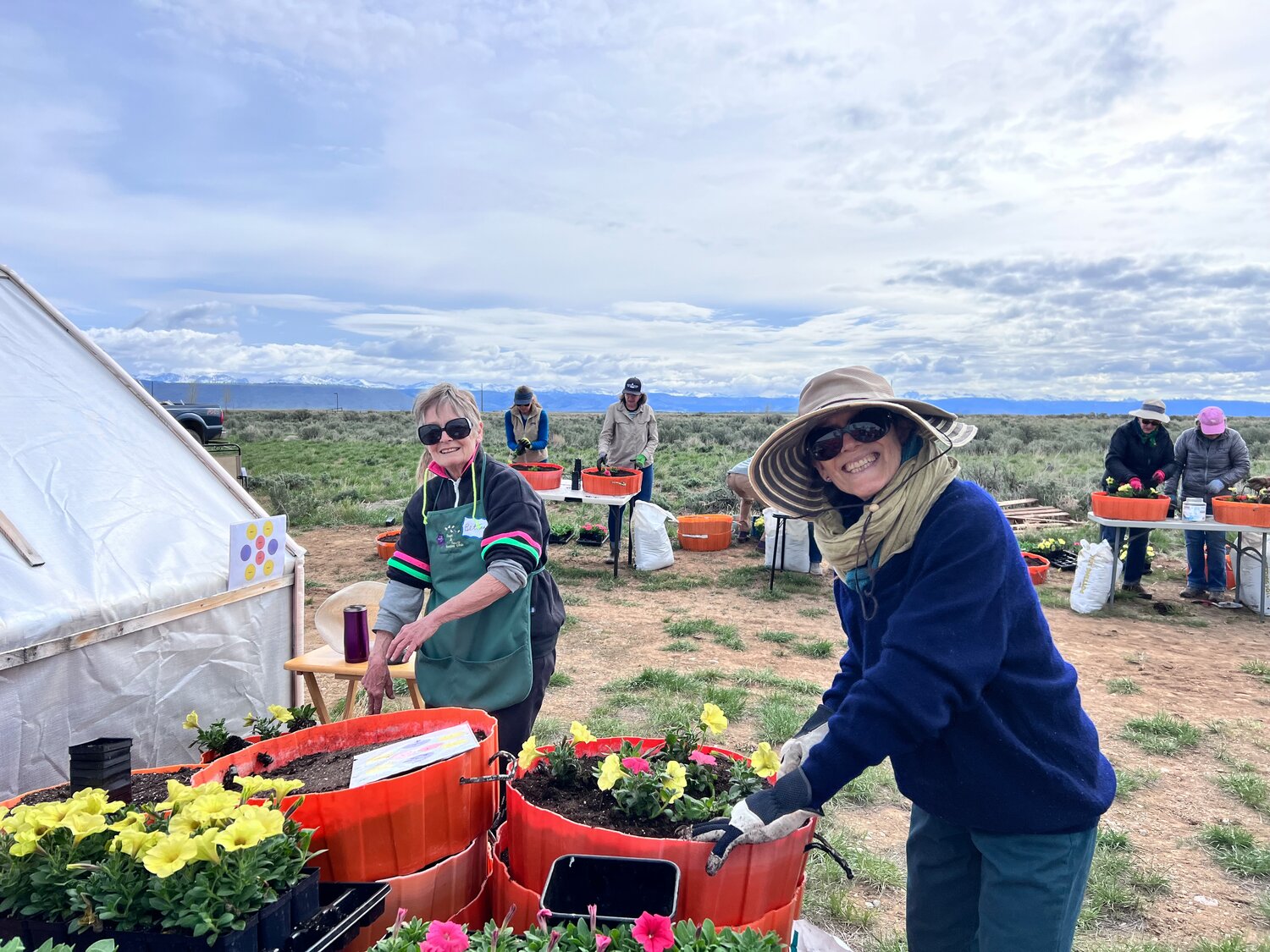 Longtime Sage and Snow member Bettina Sparrowe and her friend Enid planting flowers to beautify Pinedale