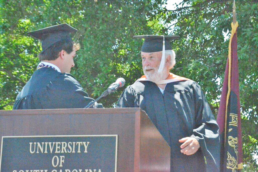 Former students and colleagues are mourning the loss of Professor Joe
Siren, pictured here receiving his Professor of the Year award in 2016.