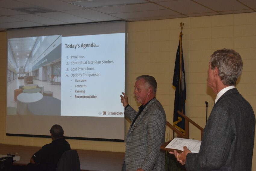 Four concepts were presented by Tim Williams (left), the principal architect of SSOE, the district’s architect/engineering firm, and Jeffrey Reynolds (right) of H.G. Reynolds, a Construction Management At-Risk Services firm as well as the district’s project manager.