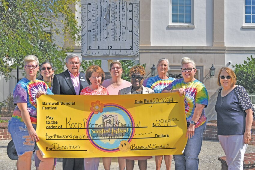 The Barnwell Sundial Committee presented a check with proceeds from the annual festival to Keep Barnwell County Beautiful. 
Pictured from left to right: 
Ashley Kearse Culp, Barbara Christian, Ben Kinlaw, Peggy Kinlaw, Nicole Conklin, Evelyn Coker, Rowlanda “Ronnie” McClain, Amy Davis, and Liz Ringus. 