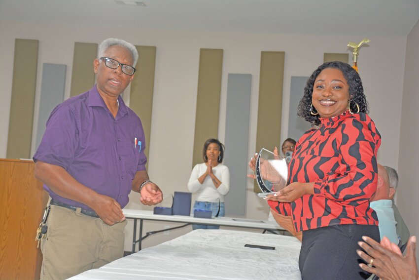 Kline Mayor William Cave presents a plaque to Shekinah Williams, former town clerk, for her 10 years of service.