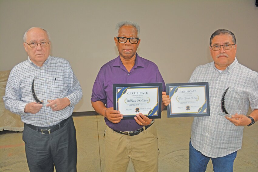 Former town council members Milton Harden (left) and Jesus "Jessie" Ortiz (right) were recognized for their years of service to the town. They recently left their positions on council. Mayor William Cave (center) was recognized for his service on the program committee.