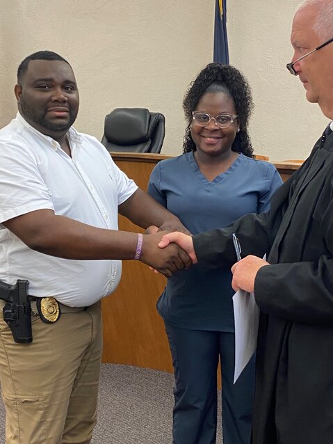 Howze is pictured with his wife, Audriana, and Blackville magistrate judge Jimmy Gantt Jr. after taking the oath of office on July 9. 
