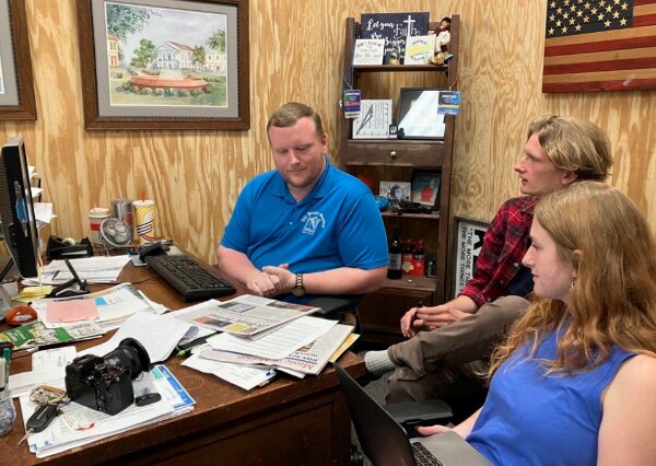 Our team during a meeting in our old one-room office on Barnwell's Main Street.