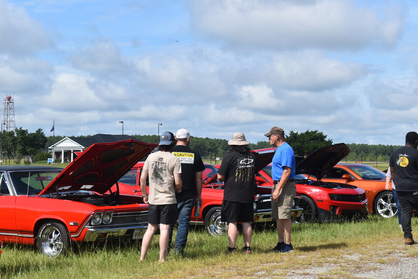 A good crowd enjoyed looking at the variety of cars and bikes while also checking out the adoptable dogs.