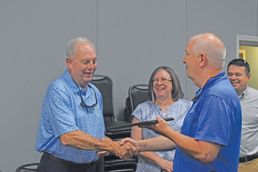 Blackville Magistrate Judge Jimmy Gantt Jr. (right) presents a plaque to retiring Williston Magistrate Judge Robert Cooper on June 10.