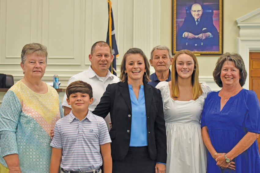 New magistrate judge Carla Deering was joined by her family on July 12 as she took the oath of office. Pictured from left: her mother Jacquie Hicks, son Luke, husband Andy, Carla Deering, father-in-law David Deering, daughter Abby, and mother-in-law Debra Deering.