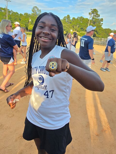 Shalayah Badger, #47, proudly displays her World Series ring.