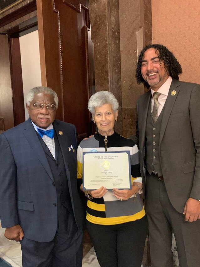 Cheryl Long with S.C. Representative Lonnie Hosey and Representative Justin Bamberg. 
