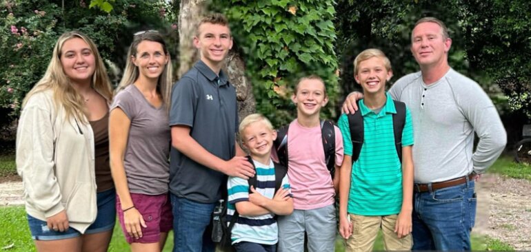 The Altman family smiles on the first day of school for Barnwell County students before their eldest son, Isaiah, travels north to start his journey at a boarding school on September 6.