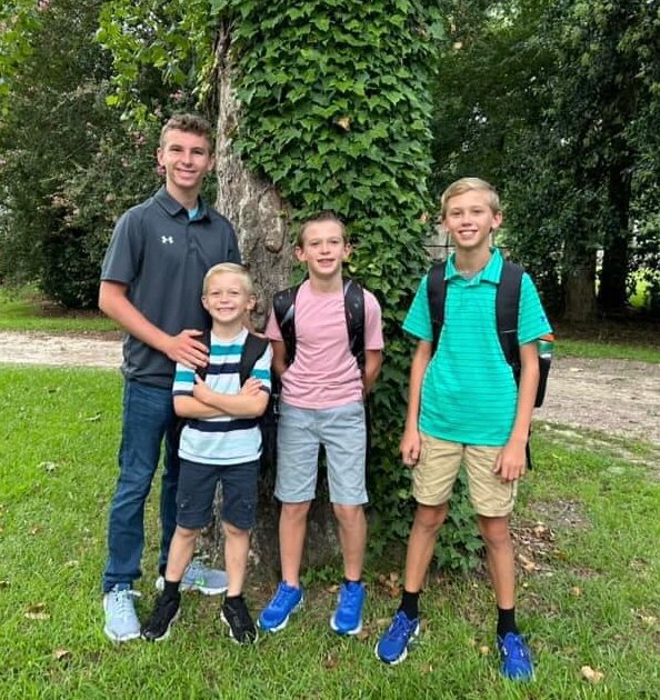 Isaiah Altman (left) smiles alongside his siblings as they head off for their first day of school. Altman will be attending St. Paul's School in Concord, New Hampshire to complete his high school education.