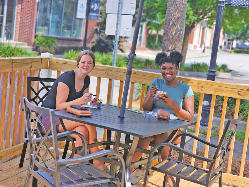 Two customers enjoying an acai bowl at downtown Barnwell's newest business. 