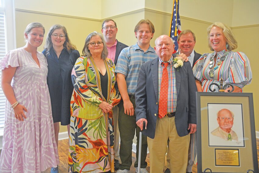 Tom Boulware is joined by his children and grandchildren at the celebration honoring over 50 years of municipal legal counsel.