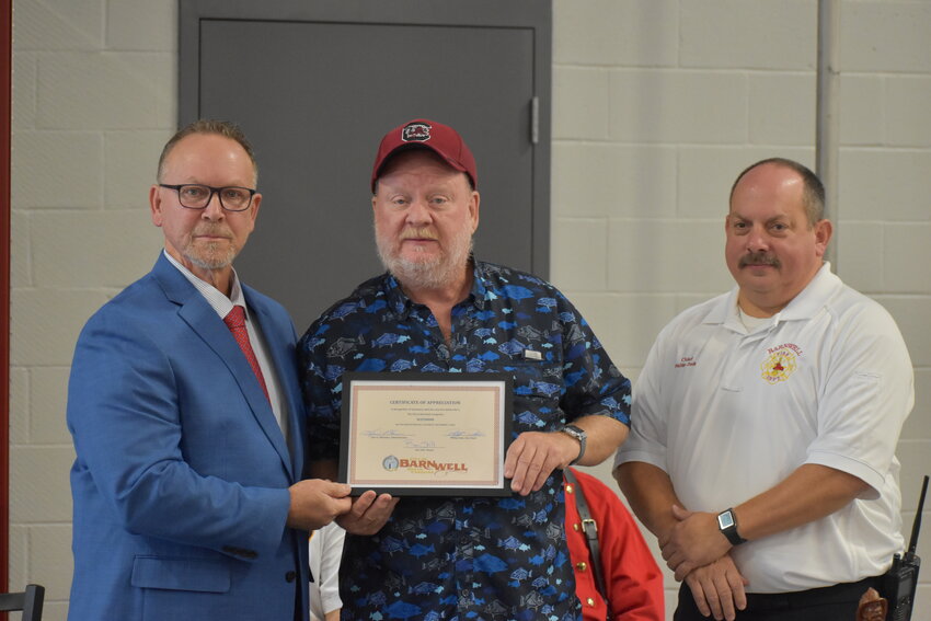 A Scotsman representative was honored at the event for the company's donation of an ice maker to the new station. 