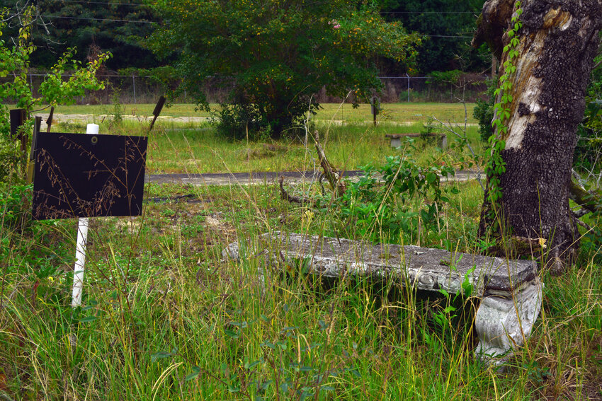 An abandoned bench on the lawn of the CV Bing school; numerous ideas have been floated for transforming the building's landscape.