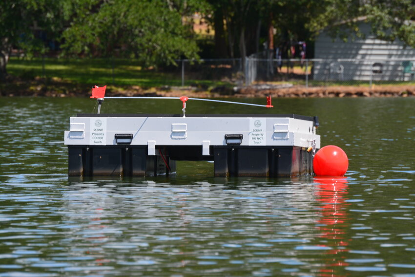 DNR's ultrasonic device floating on the surface of Lake Edgar Brown.