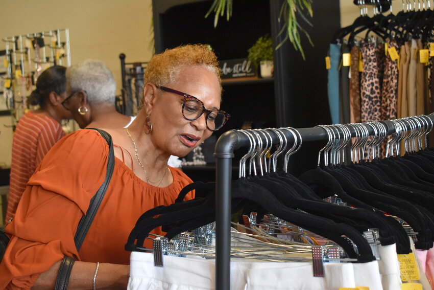 Customers peruse the racks of clothing at Sistas Closet on the first day in business for the Blackville consignment and alteration store.