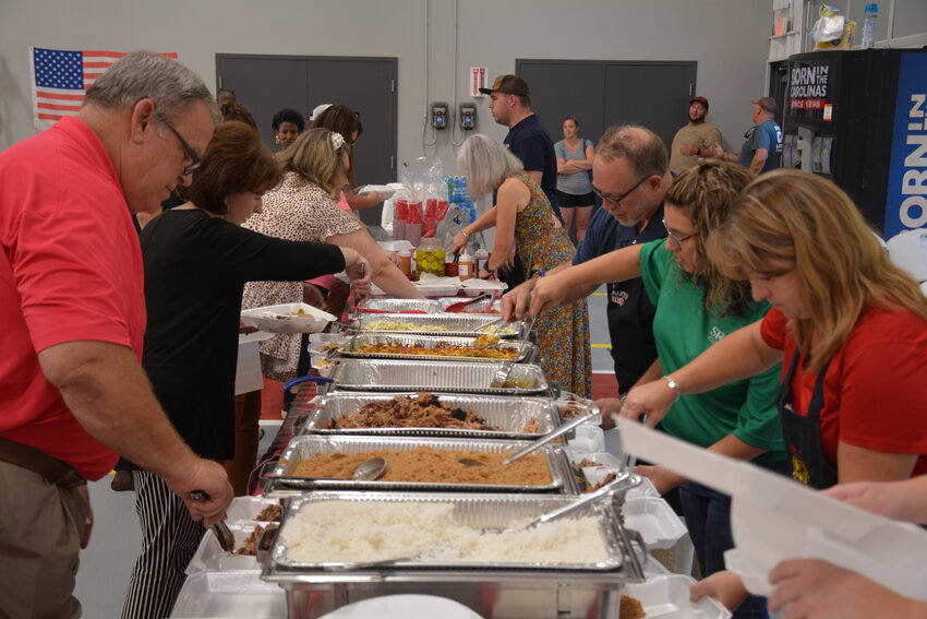 City of Barnwell officials along with representatives of SRP Federal Credit Union joined other volunteers to fix plates for first responders and linemen on Sept. 28 during the Public Service Banquet. The banquet's program was cancelled but the meal was still served.