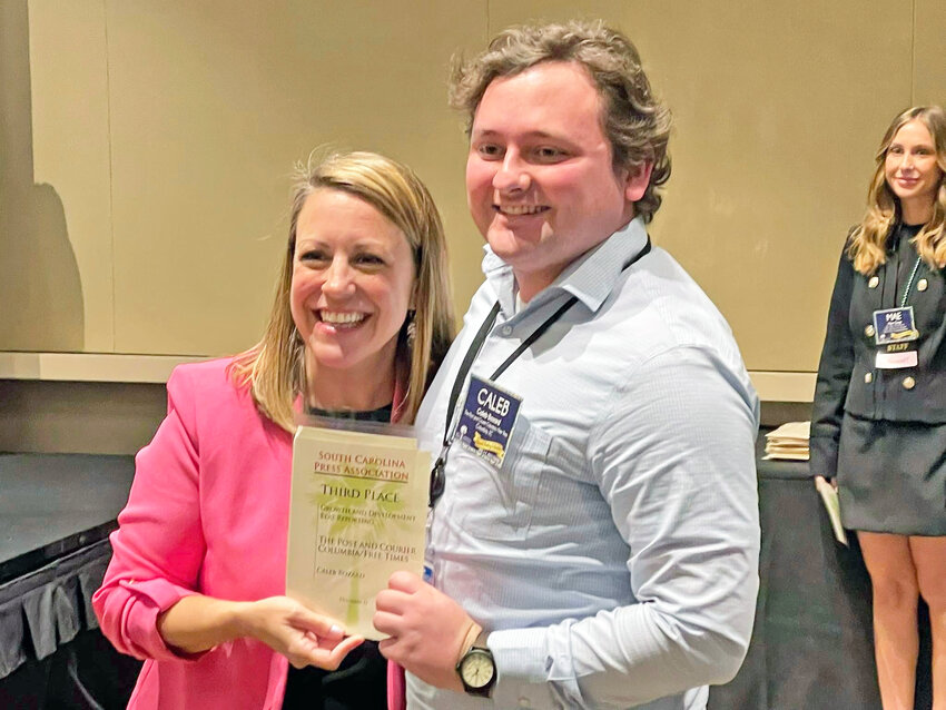Barnwell native Caleb Bozard, a reporter for The Post & Courier Columbia, won two awards at the S.C. Press Association's awards lunch on April 4. He's pictured with Jen Madden, co-executive director of SCPA.
