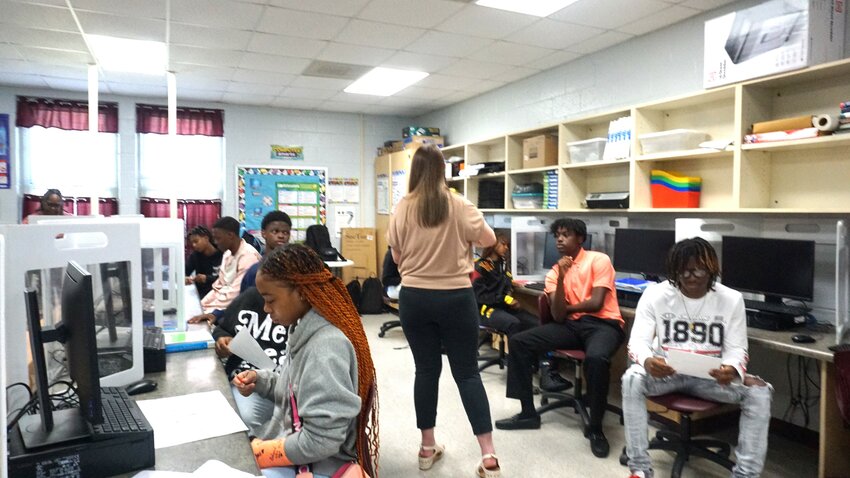 Students in the financial literacy class at Blackville-Hilda High School take part
in activities led by SRP Federal Credit Union staff.