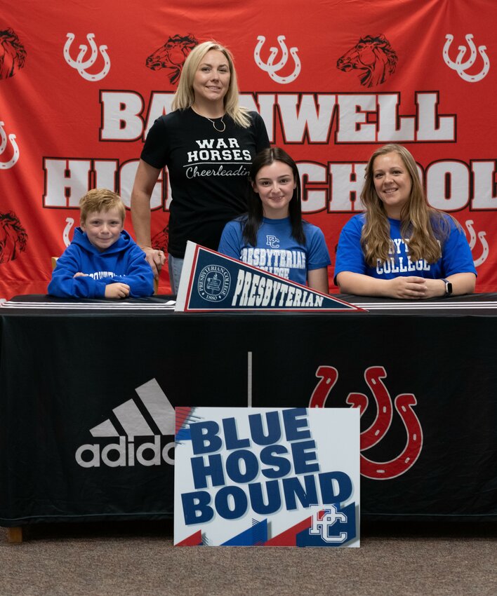 Katelynn Ryan will do competitive cheer for Presbyterian College this fall. She’s pictured with her brother, Brantley Cobb, Barnwell High School sideline and competitive cheer coach Amy Williams, and her mother Denise Cobb.