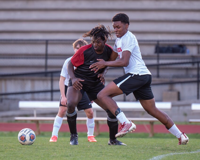 AJ Miller battles for possession here and later scored his first goal for the Horses.