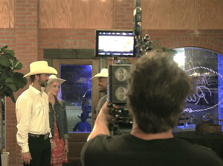 Terry Weaver (left) and Laynee Busse shoot a scene with Daryl Jones for the film “The Beast of Trinity Texas.”