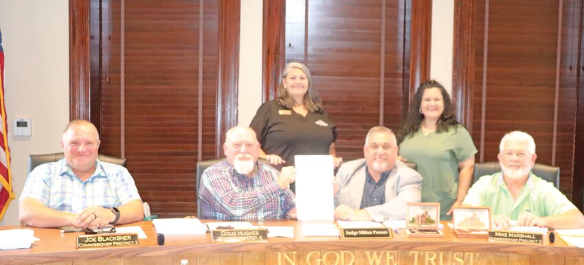 Tyler County Commissioners Joe Blacksher, Doug Hughes, County Judge Milton Powers and Commissioner Mike Marshall passed a resolution honoring "Elder Abuse Awareness Month" in Tyler County. Pictured from the Adult Protective Services advisory board are Elaine Jefferson and Rachel Hadnot.