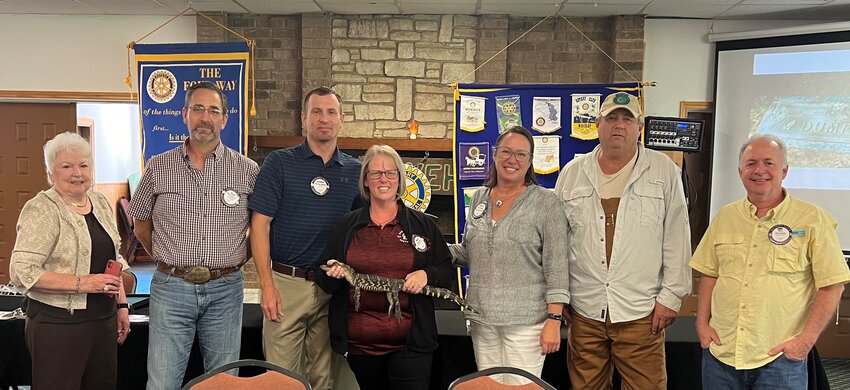 Wildlife Biologist Chris Gregory recently spoke the Rotary Club of Livingston and even brought a baby alligator with him. (l-r) Rotarian Judy Cochran, Rotarian Blake Thornton, Rotarian Brandon Wigent, Rotarian Mindy Ellis (holding baby alligator), Rotarian Kirsty Halliday, Guest Speaker Chris Gregory and Rotarian Will Watson. Courtesy photo