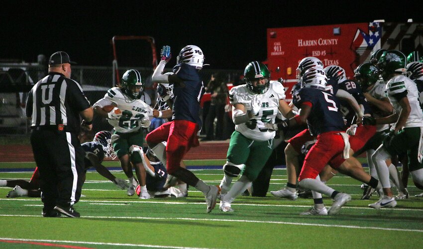 Livingston's Trenden Williams breaks tackles Friday night versus Hardin-Jefferson. The senior running back had 137 yards and two touchdowns in the game.