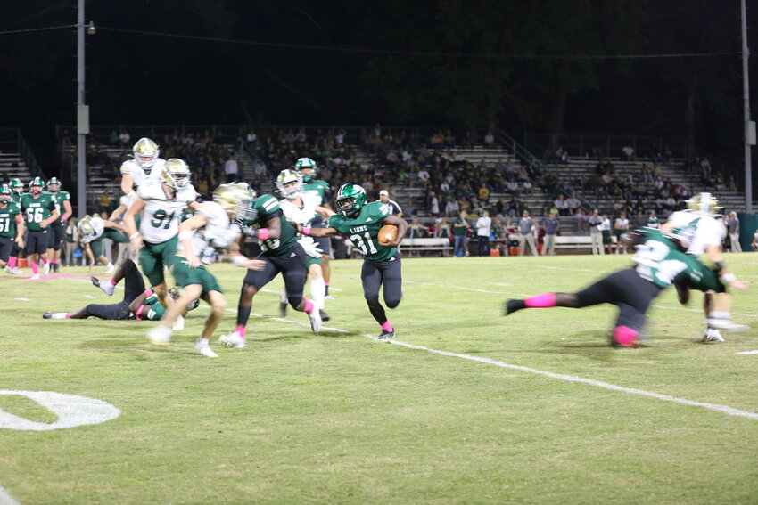 Livingston running back Ja'kegdrick Walker sets up his blocks Friday versus Little Cypress-Mauriceville.