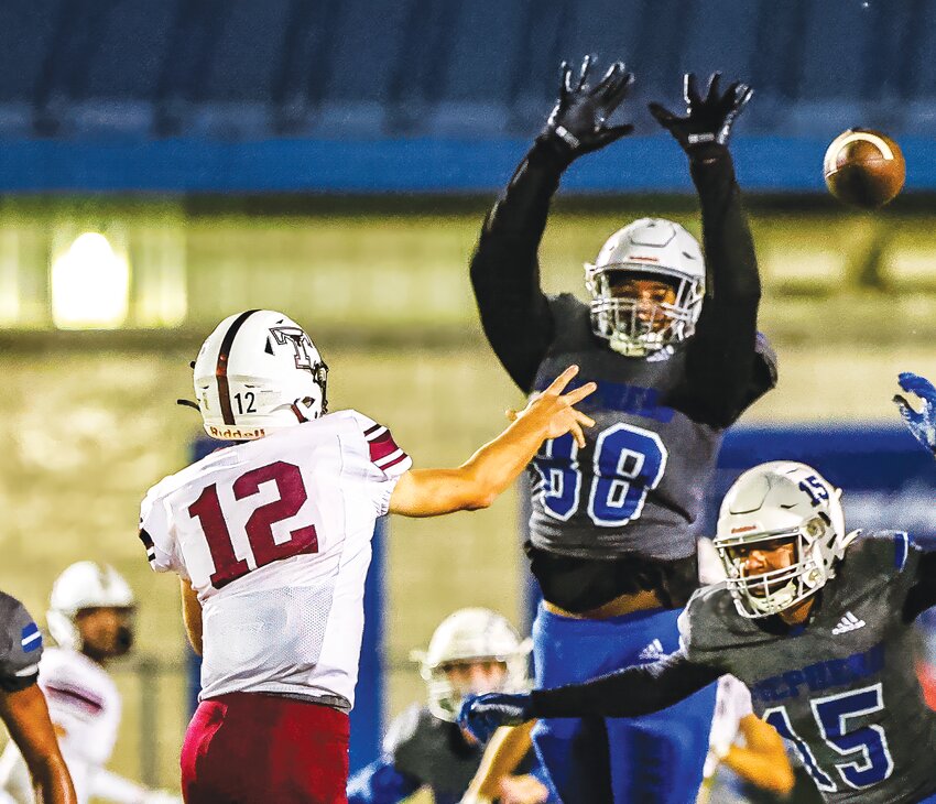 Brayden White (No. 88) towers over the Tarkington offense all night long as the Pirates take a 50-32 win. PHOTO BY CHARLES BALLARD