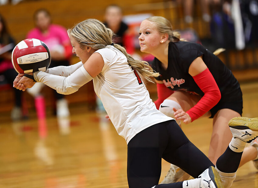 Kinsey Reynolds digs off the deck during the game against the Lady Owls. PHOTO BY CHARLES BALLARD