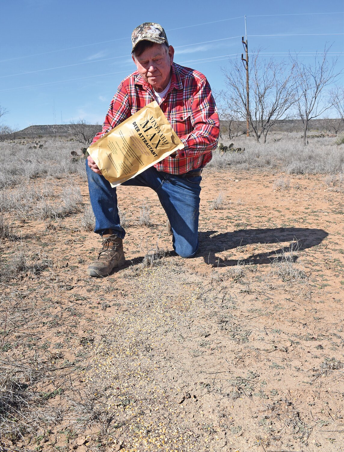 Luke is baiting an area for deer with Vineyard Max Deer Attractant, made primarily with dried grape skins. There are many attractants on the market but this food-based product that emits the smell of grapes brings deer in from a great distance.