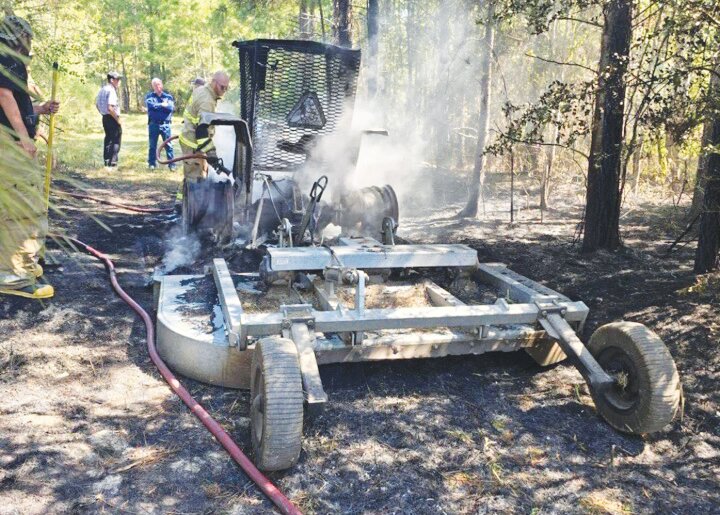 A tractor was heavily damaged after catching fire.  COURTESY PHOTO