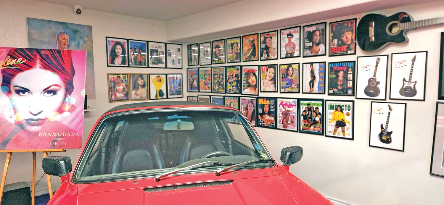 Selena’s red Porsche, considered to be her only splurge, is parked in the museum in front of a wall full of framed magazine covers of Selena