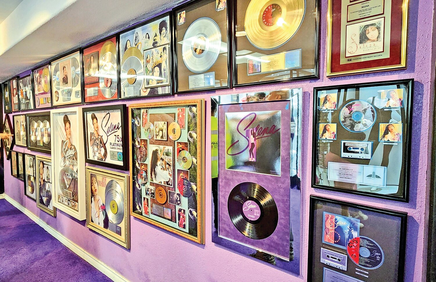 This wall is filled with some of Selena’s highest-selling albums and CDs.